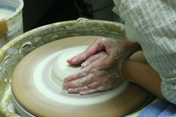 centering clay on pottery wheel